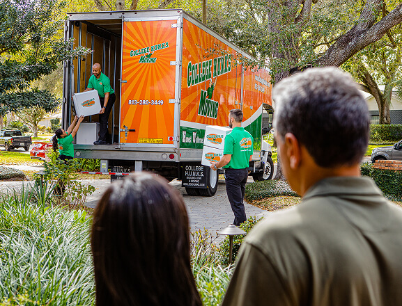Homeowners watching movers